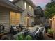 Cozy outdoor patio with brick pavers and comfortable seating for entertaining and relaxing under the evening sky at 200 Mystic Ct, Atlanta, GA 30342