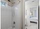 Shower with white tiled wall and fixtures, and bedroom view at 200 Mystic Ct, Atlanta, GA 30342