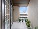 A view from the balcony shows the city skyline, as well as potted plants at 901 Abernathy Ne Rd # 5140, Sandy Springs, GA 30328