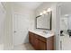 This modern bathroom features a vanity with dark wood cabinets at 901 Abernathy Ne Rd # 5140, Sandy Springs, GA 30328