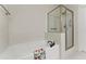 Bright bathroom featuring a soaking tub with a shower and subway tile, creating a spa-like atmosphere at 901 Abernathy Ne Rd # 5140, Sandy Springs, GA 30328