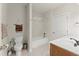 A bright bathroom with a shower-tub combo, toilet and sink at 901 Abernathy Ne Rd # 5140, Sandy Springs, GA 30328