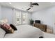 Serene bedroom featuring a ceiling fan, ample natural light, and modern furnishings for a comfortable retreat at 901 Abernathy Ne Rd # 5140, Sandy Springs, GA 30328