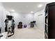 This home office boasts neutral walls and carpet and has a chair, desk and exercise equipment at 901 Abernathy Ne Rd # 5140, Sandy Springs, GA 30328