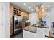 This kitchen has stainless steel appliances, granite countertops, and dark wood cabinets at 901 Abernathy Ne Rd # 5140, Sandy Springs, GA 30328