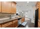 A well-lit kitchen featuring granite countertops, stainless steel appliances, and dark hardwood floors at 901 Abernathy Ne Rd # 5140, Sandy Springs, GA 30328