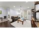 Inviting living room with dark hardwood floors, a comfortable couch, and access to a balcony at 901 Abernathy Ne Rd # 5140, Sandy Springs, GA 30328