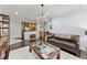 Open living area with a kitchen view, featuring hardwood floors, modern decor, and bright lighting at 901 Abernathy Ne Rd # 5140, Sandy Springs, GA 30328