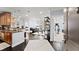 Open-concept living area with hardwood floors, modern decor, and seamless flow to the kitchen at 901 Abernathy Ne Rd # 5140, Sandy Springs, GA 30328