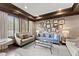 Bright living room with neutral walls, wood trim, large windows, and comfortable seating at 901 Abernathy Ne Rd # 5140, Sandy Springs, GA 30328