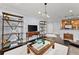Spacious living room showcasing dark hardwood floors, modern furnishings, and abundant natural light at 901 Abernathy Ne Rd # 5140, Sandy Springs, GA 30328