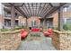 Cozy outdoor lounge area with stone pillars and comfortable seating at 901 Abernathy Ne Rd # 5140, Sandy Springs, GA 30328