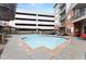 Community pool with sun loungers and an adjacent parking garage at 901 Abernathy Ne Rd # 5140, Sandy Springs, GA 30328