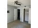 Carpeted bedroom features a ceiling fan and closet, freshly painted in neutral gray tone at 108 Countryside Se Pl, Smyrna, GA 30080