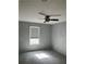 Bedroom with a ceiling fan and a window with shades, freshly painted in neutral gray tone at 108 Countryside Se Pl, Smyrna, GA 30080