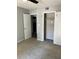 Neutral-toned bedroom showcasing a ceiling fan, closet, and door leading to additional space at 108 Countryside Se Pl, Smyrna, GA 30080