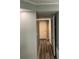 A hallway features new paint, modern laminate flooring, and updated doors at 108 Countryside Se Pl, Smyrna, GA 30080