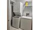 Laundry room with stacked washer and dryer and adjacent freezer at 108 Countryside Se Pl, Smyrna, GA 30080