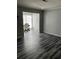Living room featuring gray walls, wood-look floors and lots of natural light at 108 Countryside Se Pl, Smyrna, GA 30080