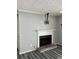 Living room showing the fireplace and wood-look floors at 108 Countryside Se Pl, Smyrna, GA 30080