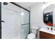 Modern bathroom with a stylish vanity, toilet, and updated glass enclosed shower at 1326 Stella Sw Cir, Mableton, GA 30126