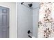 Stylish bathroom shower with sleek tile and modern fixtures with decorative shower curtain at 1326 Stella Sw Cir, Mableton, GA 30126