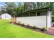 Home exterior highlighting a well-maintained lawn and screened porch at 1326 Stella Sw Cir, Mableton, GA 30126