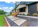 Charming home exterior showcasing a neatly landscaped front yard and stone walkway at 1326 Stella Sw Cir, Mableton, GA 30126
