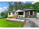 Landscaped single-story home with a lush lawn, and contemporary exterior paint at 1326 Stella Sw Cir, Mableton, GA 30126
