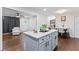 Open concept kitchen with stainless steel appliances and easy access to the living room and dining area at 1326 Stella Sw Cir, Mableton, GA 30126