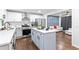 Eat-in kitchen featuring stainless steel appliances, a center island, and seamless flow to the living area at 1326 Stella Sw Cir, Mableton, GA 30126