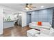 Open-concept living room with hardwood floors, and easy access to the kitchen at 1326 Stella Sw Cir, Mableton, GA 30126