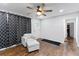 Living room with cozy furniture, curtains, wood-look flooring and ceiling fan at 1326 Stella Sw Cir, Mableton, GA 30126