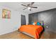 Main bedroom featuring a unique accent wall, hardwood floors, and natural light at 1326 Stella Sw Cir, Mableton, GA 30126