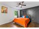 Main bedroom featuring a unique accent wall, hardwood floors, and natural light at 1326 Stella Sw Cir, Mableton, GA 30126