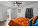 Main bedroom featuring hardwood floors, unique wall decor, and access to an en suite bathroom at 1326 Stella Sw Cir, Mableton, GA 30126