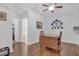 Bright breakfast nook with wood floors, neutral paint, a fan, and charming plate collection, providing a comfortable dining space at 1402 Silver Summit Se Dr, Conyers, GA 30094