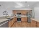 Modern kitchen with stainless steel appliances, quartz countertops, wooden cabinets, and open concept design at 1402 Silver Summit Se Dr, Conyers, GA 30094