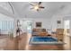 Welcoming living room with hardwood floors, a vaulted ceiling, and an open layout leading to other rooms of the house at 1402 Silver Summit Se Dr, Conyers, GA 30094