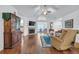 Spacious living room with vaulted ceilings, a fireplace, hardwood floors, and ample natural light to create a welcoming atmosphere at 1402 Silver Summit Se Dr, Conyers, GA 30094