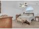 Serene bedroom boasts soft carpet, a cozy bed, and simple furnishings for a peaceful retreat at 1402 Silver Summit Se Dr, Conyers, GA 30094