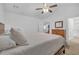 This main bedroom features plush carpet, a neutral color palette, and an en-suite bathroom for ultimate comfort and convenience at 1402 Silver Summit Se Dr, Conyers, GA 30094