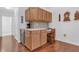 Built-in office space with ample cabinets, desk, and wine cooler offering a functional and stylish workspace at 1402 Silver Summit Se Dr, Conyers, GA 30094