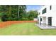 Expansive backyard with lush lawn, patio, and modern privacy fence at 2220 Meadowvale Ne Dr, Atlanta, GA 30345