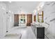 Elegant bathroom featuring a soaking tub, walk-in glass shower and double sink vanity with marble countertops at 2220 Meadowvale Ne Dr, Atlanta, GA 30345