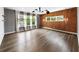 Spacious bedroom featuring hardwood floors, modern lighting, and multiple windows at 2220 Meadowvale Ne Dr, Atlanta, GA 30345