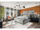 Sun-filled main bedroom with hardwood floors, large windows, and neutral decor at 2220 Meadowvale Ne Dr, Atlanta, GA 30345