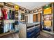 Walk-in closet featuring custom closet organizers, center island, and hardwood floors at 2220 Meadowvale Ne Dr, Atlanta, GA 30345