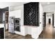 View of the modern kitchen with stainless steel appliances and black accents at 2220 Meadowvale Ne Dr, Atlanta, GA 30345