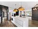 Open concept kitchen with stainless steel appliances, kitchen island and view to the living room at 2220 Meadowvale Ne Dr, Atlanta, GA 30345